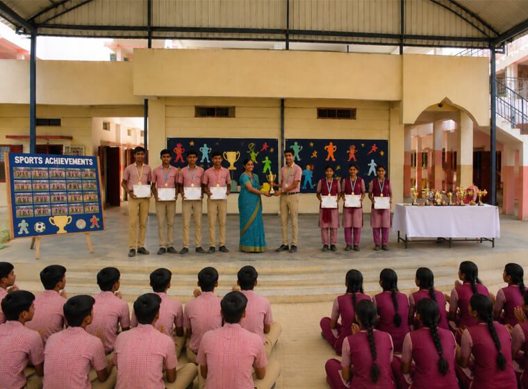 Students with sports trophies